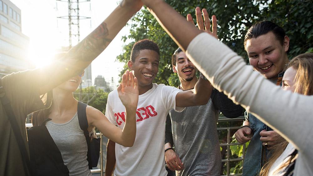 High School students giving each other high fives